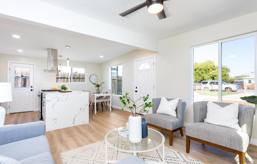 Investor’s Dream with R-2 Zoning in Prime Imperial Beach Location! VA Assumable @ 4.125 rate. This beautifully renovated 3-bedroom, 2-bathroom home sits on a spacious lot with alley access, zoned R-2—offering an exceptional opportunity to build an ADU (renderings included) or further develop the property to maximize its full potential. Whether you're an investor or a homeowner seeking growth, this home checks every box! Step inside to discover a modern open layout featuring a gourmet kitchen complete with quartz countertops, stainless steel appliances, sleek cabinetry, a statement waterfall island with premium vinyl flooring and high-end door hardware, recessed lighting, and dual-pane vinyl windows. Both bathrooms have been tastefully updated with contemporary finishes and fixtures. The home also offers central A/C for year-round comfort. Enjoy outdoor living a huge backyard ready for your creation and double-gated alley access—perfect for entertaining, expansion, or adding additional structures. Located just over a mile from the Imperial Beach Pier, and close to military bases, Coronado, beaches, freeways, dining, and shopping. Includes architectural renderings illustrating the addition of a 754 sq ft detached ADU and a 495 sq ft Junior ADU (JADU), for an additional 1,249 sq ft, totaling 2,228 sq ft. A current tenant is in place and flexible to stay or vacate based on preference, making this a turnkey investment or owner-user opportunity. Don't miss your chance to secure a move-in-ready home with long-term upside in one of San Diego’s most exciting coastal communities! This R-2 zoned property offers outstanding investment potential with included architectural renderings illustrating the addition of a 754 sq ft detached ADU and a 495 sq ft Junior ADU (JADU), totaling an additional 1,249 sq ft. With the existing residence, this creates a combined potential living area of approximately 2,228 sq ft across three units. Perfect for multigenerational living or income-generating rental opportunities.