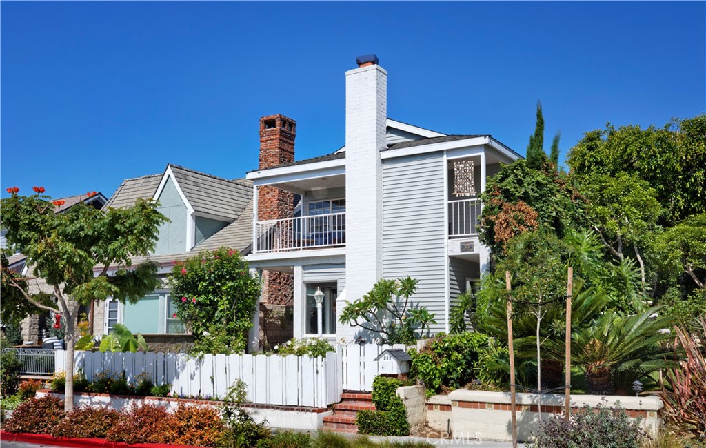 Traditional Single Family Home Unfurnished for lease in exclusive Corona del Mar Flower streets south of PCH has 3 bedroom plus sitting room off master suite and 3 1/2 Baths. On the main floor off the kitchen is the family room w/fireplace and separate dinning room. The spacious game room includes a fireplace, wet bar a door to the back yard and 2 car garage plus golf cart space. Included are washer & dryer, refrigerator all appliances. Spacious Master bedroom with outdoor veranda and peek boo views of Ocean also includes a side TV/baby's room. Hardwood floors and stone on the 1st floor and carpet in bedrooms. Just a few blocks from little Corona Beach, shopping and restaurants.