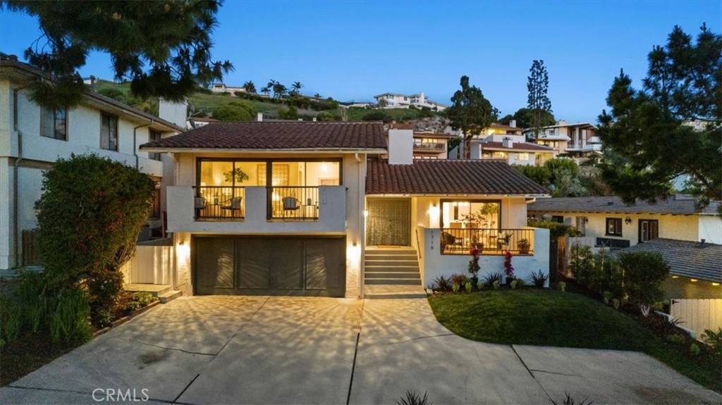 Freshly manicured landscaping and timeless curb appeal welcome you to this beautifully refreshed contemporary Spanish home in upper Lunada Bay. Step through the double front doors into a bright, airy foyer with sightlines through the family room to the expansive back patio.
To the right, a formal dining room with vaulted ceilings and ocean views invites elegant entertaining. To the left, a staircase leads up to the spacious formal living room, also featuring soaring ceilings. Both the dining and living rooms open to private balconies—perfect for enjoying ocean breezes, golden sunsets, and pastoral views.
Wide-plank sand-colored French oak floors, new interior paint, contemporary brushed nickel fixtures, and a brand-new AC system lend a crisp, modern feel throughout. The recently remodeled kitchen is outfitted with new stainless steel appliances, marble countertops, and ample cabinetry—ready for the home chef. The primary bathroom has also been thoughtfully remodeled with high-end finishes, creating a luxurious retreat. A refreshed hall bathroom complete the picture.
The functional floor plan offers flexibility: the primary suite is conveniently located near two additional bedrooms, a remodeled hall bathroom, and the laundry room. A fourth bedroom—ideal as a home office or guest room—is privately set off the living room.
Out back, a large patio offers ample space for outdoor dining and lounging. Beyond it, a generous flat lawn with new sod is perfect for play or relaxing afternoons, surrounded by planters ready for a garden or homegrown produce.
With captivating views, updated interiors, tremendous outdoor space, and an ideal location in prestigious Palos Verdes Estates—known for its top-rated schools, peaceful streets, and scenic coastline—this home checks every box. Don’t miss the opportunity to make it yours.
