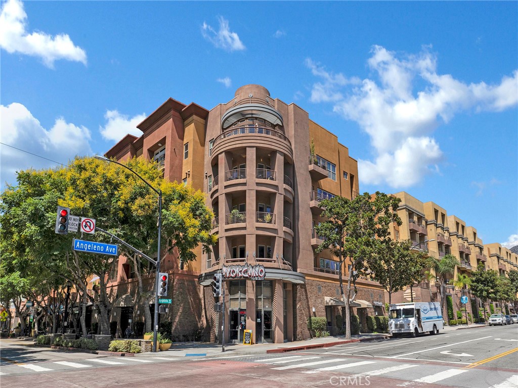 Welcome to 201 E Angeleno Avenue, a stylish single-level condo at Burbank Village Walk perfectly situated in the heart of trendy Burbank. This prime location puts you just steps away from theaters, eateries, coffee shops, fitness studios, and everything downtown Burbank has to offer.
The open-concept floor plan features a kitchen with a center island that seamlessly flows into the spacious great room—ideal for both everyday living and entertaining. A private balcony helps blend the interior and exterior space, offering the perfect spot to relax with your morning coffee or unwind in the evening.
Upscale wood flooring and modern finishes add a touch of sophistication throughout, creating a turnkey home in one of the most sought-after locations in Burbank Village Walk. Spacious primary suite with enormous walk in closet and ensuite bathroom. Secondary bedroom is good sized with an adjoining bathroom. The tall ceilings and abundant light make this space really happy space. The townhouse is equipped with central heat and air for year-round comfort. Located in the highly sought-after Burbank Village Walk complex, residents can enjoy a range of on-site amenities including a refreshing heated pool, BBQ grills, an outdoor patio fireplace with seating, a fitness center, and 24/7 security. Just steps away from some of the best restaurants, entertainment, and the Metro Link, you’ll have everything you need at your doorstep. Don’t miss the opportunity to own this rare townhouse in Downtown Burbank.
