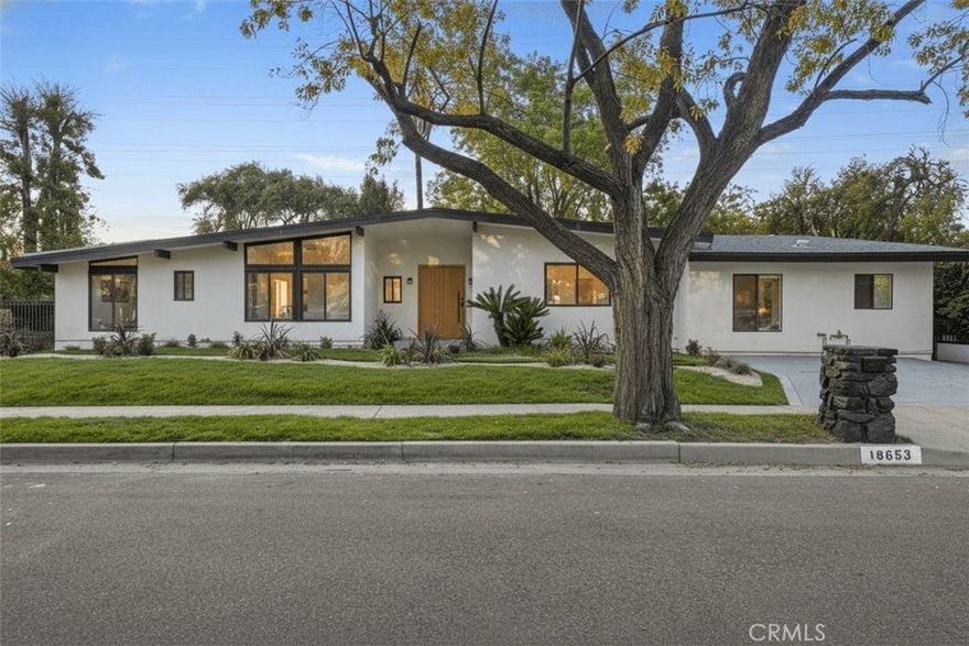 Experience refined living at 18653 Palomino, a mid century modern residence originally crafted by architect Charles du Bois AIA and now fully reimagined with contemporary elegance. The 3,152 square foot main home offers 4 bedrooms and 2.5 bathrooms with expansive open living spaces, abundant natural light, and a seamless indoor outdoor connection. The new custom kitchen serves as the heart of the home, featuring premium appliances, designer finishes, and an inviting island for gathering. The primary suite feels like a private retreat with a spa inspired bath and calming ambiance, while three additional bedrooms provide comfort and flexibility for family, guests, or a dedicated workspace. Completing the property is a separate 414 square foot 1 bedroom, 1 bathroom ADU ideal for extended family, additional income, or a private studio. A rare blend of luxury, privacy, and modern design in the heart of Tarzana.