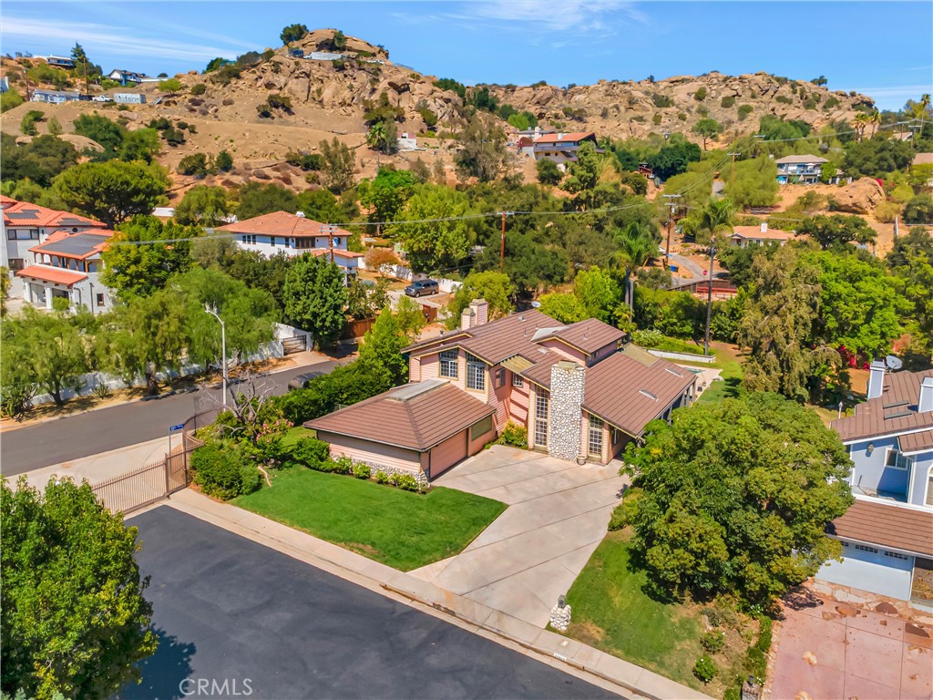 Adjacent to Bell Canyon, this light-filled, custom-built executive pool home in a private, gated enclave of only 15 residences. Situated on nearly a half acre flat lot, this 4,122 sq. ft. 4-bedroom, 3.5-bath offers a sprawling, park-like backyard with sparkling pool, mountain views, and endless space to entertain.
The open floor plan showcases grand, light-filled living spaces, including a formal living room with fireplace, a large dining room with yard views, and a welcoming family room with built-in wet bar, refrigerator, and fireplace. The chef’s kitchen boasts a center island, breakfast nook, and abundant storage. Inside laundry room and 2 car attached garage, property has an extra large driveway and large closets with built ins. Zoned for horses.
A convenient downstairs bedroom suite with private entrance is perfect for guests, a home office, or a private study. Upstairs, the luxurious primary suite offers a step-down sitting area, dual-sided fireplace, large walk-in closet. The spa-like en-suite bath features a deep soaking tub, separate shower, and double vanities. Generous secondary bedrooms complete the home. Permitted attached 504 sq. ft. bonus room, which could be easily used as 5th bedroom, gym or ADU potential as well.
Outdoors is your personal oasis ample space for kids to play, gatherings with friends, and lazy afternoons by the pool. Located minutes from dining, shopping, parks, and with easy Valley Circle access to freeways, all within the highly sought-after El Camino High School district. This is a must-see for anyone seeking privacy, elegance, and the ultimate Southern California lifestyle. Bring your vision and customize this is a rare find.