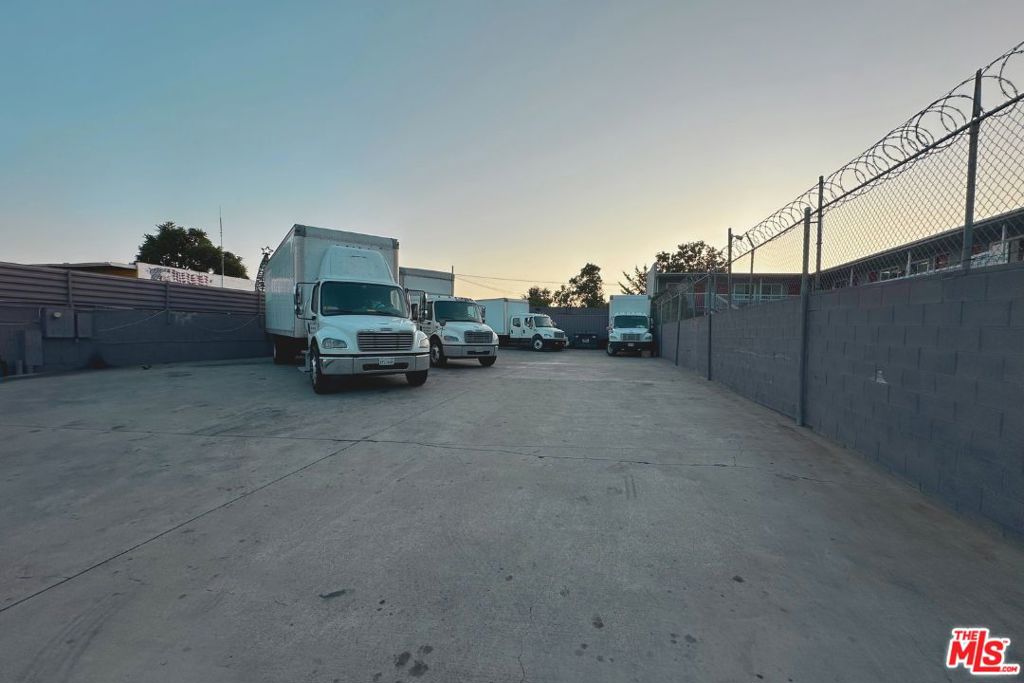 Now available for lease: a fully improved commercial/manufacturing lot located in a high-visibility corridor of Northwest Pasadena. Ideal for contractors, storage, logistics, or light industrial operations, this property offers convenience, security, and functionality in a central San Gabriel Valley location. Lot Dimensions: Approximately 60 ft frontage x 146 ft deep (8,788 SF total). Zoning: LA-MU-N. Paved Site: Entire lot is a concrete slab, ideal for parking, equipment storage, or temporary structures. Security: Property is completely enclosed with concrete block walls and security fencing. Access: Gated entrance with easy ingress/egress directly from Lincoln Ave. Location Highlights: Seconds to the 210 Freeway; Just minutes to Old Town Pasadena, La Caada Flintridge, and Glendale; Nearby services, fuel, and commercial amenities. This is a rare opportunity to lease an improved, secured parcel in a core industrial area of Pasadena. Containers currently used as office/storage facilities are available for lease at additional cost.