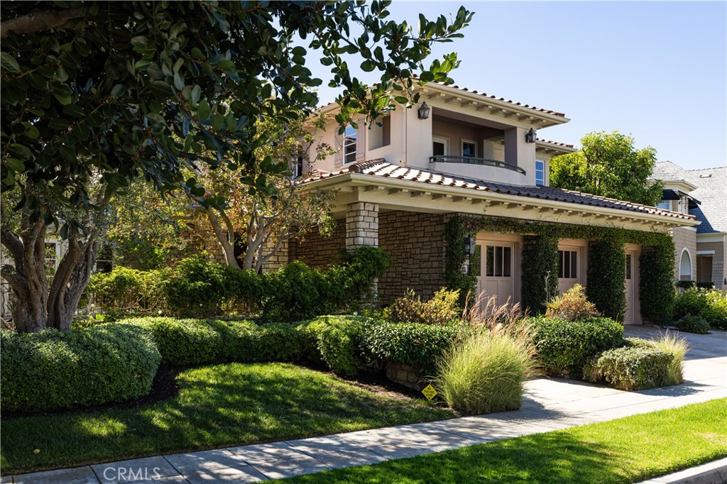 Situated in the prestigious guard-gated community of One Ford Road, 23 Gleneagles Drive is a beautifully appointed residence available for lease with an option to purchase in one of Newport Beach’s most sought-after neighborhoods. This impressive home features a grand entry with a sweeping staircase, setting the tone for its elegant interior. With four bedrooms and four and a half bathrooms, the layout offers both space and flexibility, ideal for comfortable everyday living or refined entertaining. The expansive primary suite serves as a private retreat with its own fireplace, a luxurious en suite bathroom with a jetted tub, walk-in shower, and ample closet space. Designed for indoor-outdoor living, the home includes a private patio with a built-in grill, outdoor fireplace, and spa—perfect for relaxing or hosting guests. The kitchen is equipped with high-end finishes, including Viking double ovens. Residents of One Ford Road enjoy an array of resort-style amenities, including two swimming pools, a state-of-the-art fitness center, basketball and volleyball courts, putting greens, a clubhouse, and year-round community events. This is an exceptional opportunity to lease—or potentially own—a refined home in one of Newport Beach’s most desirable communities.