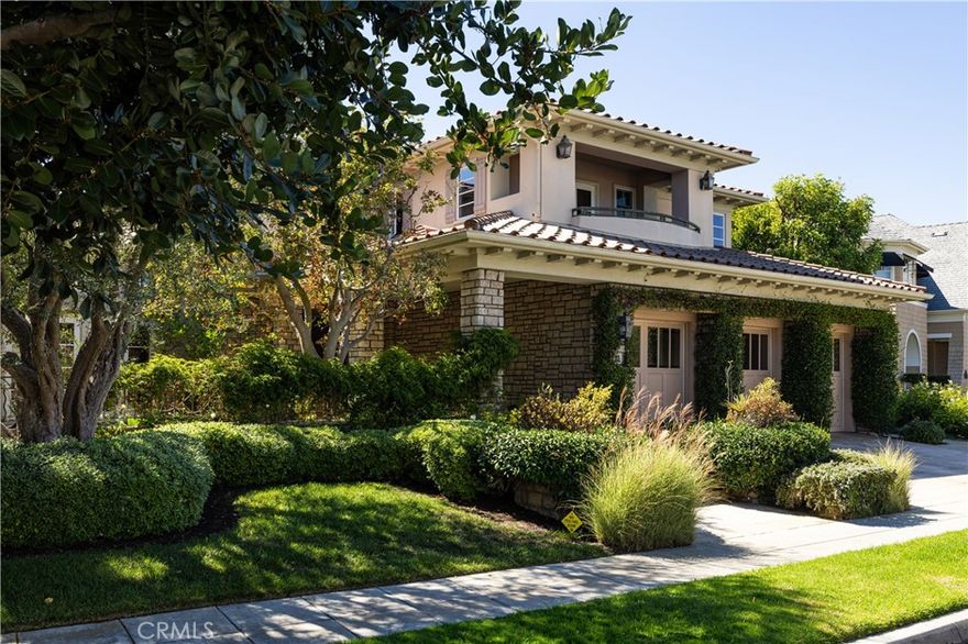 Situated in the prestigious guard-gated community of One Ford Road, 23 Gleneagles Drive is a beautifully appointed residence available in one of Newport Beach’s most sought-after neighborhoods. This impressive home features a grand entry with a sweeping staircase, setting the tone for its elegant interior. With four bedrooms and four and a half bathrooms, the layout offers both space and flexibility, ideal for comfortable everyday living or refined entertaining. The expansive primary suite serves as a private retreat with its own fireplace, a luxurious en suite bathroom with a jetted tub, walk-in shower, and ample closet space. Designed for indoor-outdoor living, the home includes a private patio with a built-in grill, outdoor fireplace, and spa—perfect for relaxing or hosting guests. The kitchen is equipped with high-end finishes, including Viking double ovens. Residents of One Ford Road enjoy an array of resort-style amenities, including two swimming pools, a state-of-the-art fitness center, basketball and volleyball courts, putting greens, a clubhouse, and year-round community events.