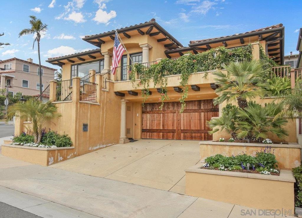 Nestled on a premier corner lot just five blocks from the San Diego Bay, this stunning Mediterranean Villa offers sweeping downtown and water views. Rebuilt in 2005, the home blends timeless charm with modern elegance—featuring an open layout, oak hardwood floors, Pella windows, and exceptional craftsmanship throughout. With direct, stair-free access from Carleton Street, the home lives like a single story—offering both a spacious primary suite and a secondary ensuite on the main level. The primary retreat includes dual walk-in closets, a spa bath, and backyard access. Downstairs features a private guest suite with its own entrance, patio, wet bar, and fitness room—ideal for multi-generational living or rental income. A detached bonus room with mini split is perfect for a home office or studio. Newly refreshed lush landscaping includes a built in gas fire pit under a gazebo, fruit trees, and a veggie garden. All just minutes from the SD Yacht Club, dining, and shops in Point Loma’s coveted Roseville neighborhood. A MUST SEE in person property!
