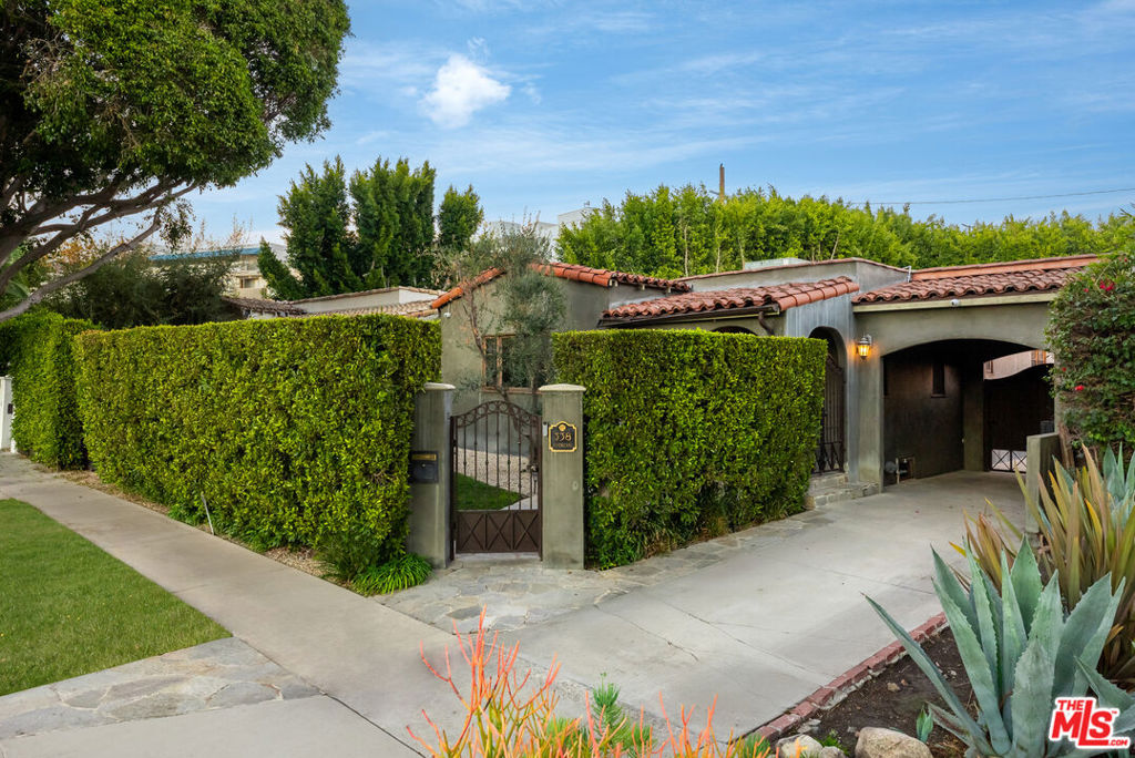 Experience refined living at 338 Westbourne Drive, nestled in the heart of West Hollywood West. This beautifully renovated home offers over 2,000 sq ft of timeless elegance, featuring natural hardwood floors, limewash walls, arched openings, and custom lighting that create a perfect balance of classic charm and contemporary upgrades. The home is complete with three bedrooms and three baths, including a newer detached ADU that offers versatile living options. The chef's kitchen is designed with both style and function in mind, featuring viking appliances, custom cabinetry, and sleek countertops. With a seamless flow to the dining and outdoor areas, it's ideal for everyday cooking or hosting gatherings. Step outside into a private retreat, where a pool, relaxing spa, and lush landscaping provide the perfect setting for both entertaining and peaceful relaxation. The outdoor space includes inviting lounging and dining areas, offering a tranquil escape from the bustle of the city. Privacy and security are top-tier, with mature hedges, a gated entry, security cameras, an alarm system, and security film on windows. Located near the vibrant Melrose Design District, this home offers unbeatable walkability to world-class shopping, dining, and cafes, and is just minutes from Cedars-Sinai and Beverly Hills.