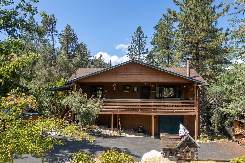 Tucked away on a quiet cul-de-sac that backs greenbelt, 2305 Rhine Court offers a furnished mountain retreat where comfort and convenience come together. The garage sits below the home, and once you’re inside, all the main living spaces are on a single level—an easy, open flow from room to room.
The family room is anchored by a wood-burning stove on a brick hearth, creating a cozy spot for cool mountain evenings. From here, the kitchen, dining, and living spaces connect seamlessly, with a back deck just steps away. Out here, you’ll hear the sound of a seasonal stream winding through the greenbelt below, a private and peaceful backdrop for your mornings or evenings outdoors.
The primary suite includes its own bath and private deck access, while the second bedroom is ready for family or guests. With laundry included, a garage below, and ample storage space under the house, practicality is built in.
Life here includes more than the home itself. Ownership in Pine Mountain Club means access to the community’s Olympic-style pool and spa, tennis and pickleball courts, golf course, equestrian center, and clubhouse activities—along with year-round essentials like road maintenance, snow removal, trash service, and 24/7 patrol. For added peace of mind, Kern County Fire Station 58, complete with paramedics and a helipad, is located right in the community.
Whether you’re looking for a weekend escape or a full-time home, this property is ready from day one—sold fully furnished so you can settle right in. All that’s left to do is bring yourself and start enjoying the quiet mountain lifestyle.