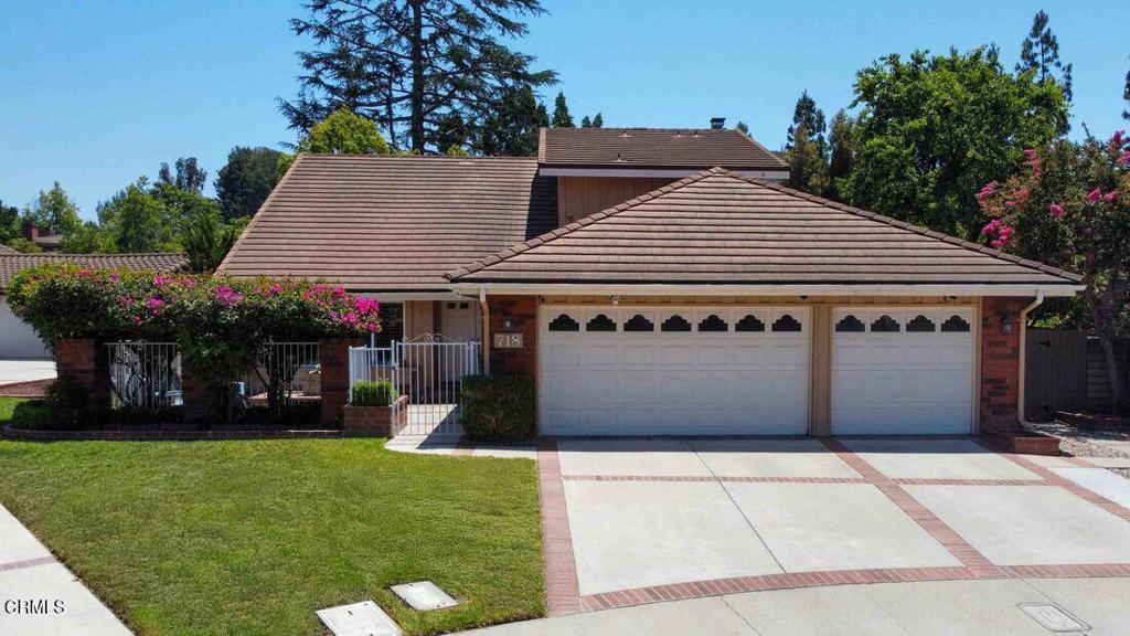 Delightful 5 bedroom, 3 bathroom, cul-de-sac home with a 3 car garage located in the beautiful community of Lynn Oaks, Thousand Oaks. This home has great curb appeal with its extended 3 car driveway leading to the gated front courtyard with brick accents and trim. Entry opens in to the high ceiling foyer featuring a spiraling staircase and gorgeous wood flooring. The adjacent living and dining room areas feature recessed lighting, plantation shutters, and great views of the front courtyard and backyard areas. The kitchen shines with granite counters, backsplash and bar overhang, pendant lights, stainless steel appliances and a pantry. The family room features an inviting fireplace surrounded with patterned porcelain tile, mantle, and custom built-in cabinets with shelving. Down the hall is the guest bathroom and first floor bedroom/office with built-in cabinets and a closet.The spiral staircase leads up to the main bedroom, 3 sizable secondary bedrooms and a bathroom. The double doors down the hall open to the spacious main bedroom with a large double door walk-in closet, outdoor balcony, and an en-suite main bathroom with granite counters, dual sinks and a tiled shower. The backyard is huge and open with a covered patio area, large concrete area, several brick lined planters along with mature trees and landscaping. Home is a short walk to Walnut Grove Park featuring BBQ grills, picnic tables, playground, basketball court, softball backstop, handball court, walking path and off-leash area. Home is conveniently located near freeway access and The Oaks Mall featuring a wide range of shopping, dining, entertainment and more.