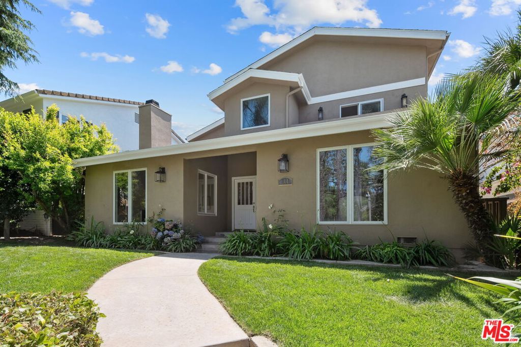 Welcome to this stunning, timeless contemporary home featuring brand new hardwood floors and fresh interior paint throughout. Thoughtfully designed for both functionality and style, the main level boasts an ideal layout with a private office and two spacious bedrooms, perfect for guests or multigenerational living. The gourmet kitchen is a chef's dream, seamlessly opening to a warm and inviting family room ideal for entertaining. A grand staircase leads you upstairs to the beautifully appointed private quarters. The upper level includes a Jack-and-Jill bedroom suite perfect for kids, an additional en-suite bedroom, and a luxurious primary suite complete with custom built-ins and a spa-inspired bathroom retreat. Step outside to your own personal oasis, featuring a sparkling pool ideal for relaxing or entertaining. A spacious two-car garage completes this exceptional property.Don't miss the opportunity to call this home yours.