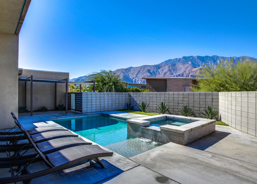 Architectural Murano home with spectacular mountain views built in 2014 at the end of a quiet and private cul-de-sac. The home epitomizes Desert living, with glass doors that open to blend the exterior with ultra high-end interiors. The master bedroom has incredible views and easy access to pool & spa. The polished concrete floors and spacious open floor plan will be an entertainers delight. Spacious driveway allows parking for up to 6 cars. The spacious wrap around private yard showcases a pebble-tec pool & spa and includes your very own putting green. Solar powered home keeps your electricity low when it counts the most. Located a few miles from newly developed Downtown Palm Springs. This is a full-term unfurnished lease not seasonal. Immediate availability.