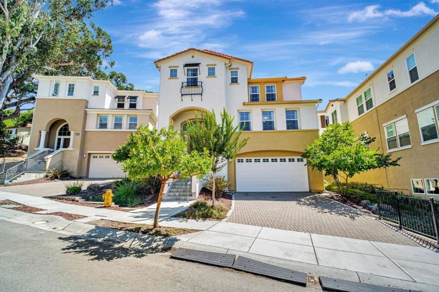 Welcome to Your Hayward Hills Retreat! Discover this Santa Barbara-style 5BD/5.5BA home built in 2019, nestled in the peaceful hills above Cal State East Bay. Thoughtfully designed with an open-concept layout, every bedroom features an en suite bath. Enjoy hand-set tile flooring, Craftsman-style finishes, and an abundance of natural light throughout. The gourmet kitchen boasts dual islands, quartz counters, Bosch appliances, and custom beech cabinetry. The spacious primary suite offers a walk-in closet and a spa-like bath with a soaking tub and oversized shower. Outdoor living is a dream, complete with a private backyard, electric fireplace, and serene hilltop views that are often visited by deer. Additional highlights include Tesla solar (owned), EV plug, tech infrastructure, tankless water heater, and a 3-car garage with flex space for a gym or game area. Minutes from schools, BART, hiking trails, and Stonebrae Country Club. This is luxury living with nature at your doorstep.