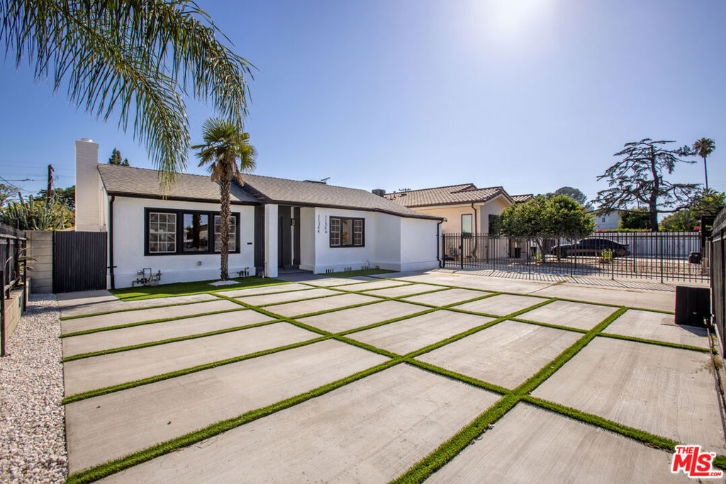 Light-filled, spacious, and effortlessly chic, this North Hollywood residence invites you into a world of modern elegance. Every corner is designed to feel both stylish and welcoming, blending clean lines with warm, generous living spaces that create the perfect backdrop for everyday life and entertaining. The gourmet kitchen is a true showpiece, featuring a 36-inch professional stove, marble countertops, an expansive island, and custom cabinetry. Flowing seamlessly into open living and dining areas, it sets the stage for gatherings both grand and intimate, all within a setting that feels sophisticated yet comfortable. Outdoors, beautifully landscaped front and rear yards are framed by a secure perimeter gate for privacy and security. At the rear, a detached garage offers the option to complete a fully permitted ADU conversion (approx. 566 sq. ft.) with soaring ceilings, its own address, 1 bedroom, 1 bathroom, and a private side entrance. The ADU comes with fully RTI plans, giving buyers the flexibility to either have the seller complete the build or finish it within 18 months themselves. Move-in ready and ideally located near the NoHo Arts District, shopping, dining, and freeways, this property offers both luxury living and future income potential.