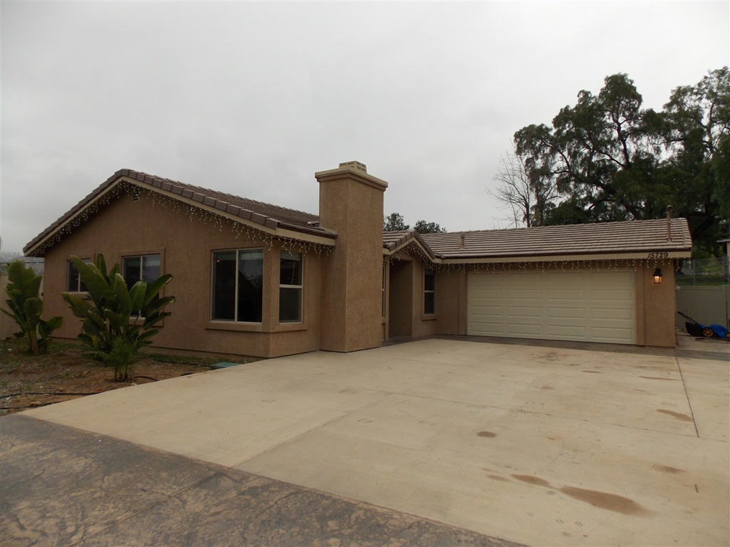 Beautifully built 2012 home with all of the bells and whistles of a new home! this light and bright single story home has 3 bedrooms, 2 baths, vaulted ceilings, granite throughout, travertine tile, custom glass shower enclosures, dual payne windows, fire sprinklers, walk in closet, nice lighting, open floor plan, gorgeous fireplace, and all stainless steel appliances come with the home! Attached 2 car garage and plenty of room for Rv's, boats and toys in his over 1/2 acre fenced in usable level yard! Neighborhoods: El Cajon /Dunbar Equipment: Fire Sprinklers,Garage Door Opener, Range/Oven, Shed(s) Other Fees: 0 Sewer: Septic Installed Topography: LL