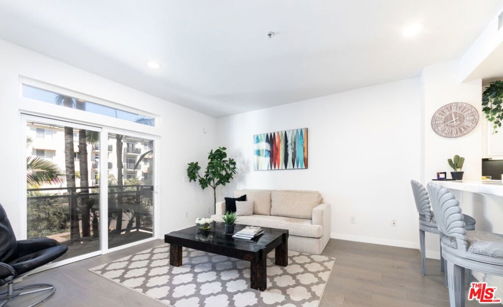 Stylish Coastal-Inspired Corner Unit in the Heart of Playa Vista Step into refined coastal living with this beautifully renovated residence in the highly desirable Crescent Walk community of Playa Vista. Designed with a light beach aesthetic, this sophisticated corner unit is bathed in natural light and offers an open-concept floor plan featuring hardwood floors, recessed lighting, and motorized shades for effortless comfort. The modern kitchen boasts a chic glass tile backsplash and premium appliances, perfectly suited for entertaining or everyday ease. Additional highlights include in-unit washer and dryer, central heating and air conditioning, designated garage parking, and access to EV charging stations. This unit can be leased, furnished or unfurnished. High speed Wi-Fi and cable TV are included in the rent for your convenience. Crescent Walk residents enjoy access to a host of luxury amenities, including an Olympic-sized pool with private cabanas, a soothing spa, a state of the art fitness center, and 24-hour security patrol. Beyond the front door lies the vibrant Playa Vista community renowned for its lush parks, farmer's markets, and curated retail and dining experiences. Enjoy easy access to Runway Playa Vista, Whole Foods, Cinemark, and a dynamic social calendar filled with concerts, yoga in the park, and seasonal events. Tech and creative professionals will also appreciate the proximity to Silicon Beach, home to major companies like Google, YouTube, and Facebook. Available furnished or unfurnished with pricing based on furnishing preferences and lease duration.