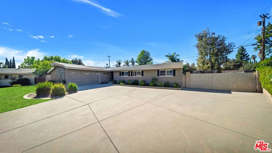 Stunning Porter Ranch Pool Home with AN EXPANSIVE nearly 15,000 sqft lot! Discover this well maintained single level corner lot property within the highly coveted Porter Ranch community. Featuring an inviting entry with direct sitelines to the rear yard. This home offers abundance natural light, spacious living room with warm fireplace, separate formal dining area, seamless indoor outdoor flow perfect for both everyday living and entertaining. The modern kitchen equipped with ample cabinetry, stainless-steel appliances, and generous counter space & island. The home's well-designed layout includes comfortable bedrooms, updated bathrooms, and great storage throughout. Enjoy resort-style California living in the private backyard complete with a sparkling pool, lush landscaping, and plenty of patio space for outdoor dining and relaxation. The property is nestled on a quiet, tree-lined street within the highly sought-after Granada Hills Charter High School boundary (buyer to verify) and just minutes from shopping, dining, parks, the Vineyards at Porter Ranch, and freeway access. Move-in ready and impeccably maintained, this Porter Ranch gem offers comfort, style, and exceptional value. Don't miss the opportunity to make it yours!
