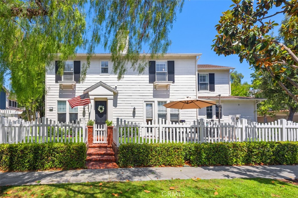 Welcome to Your Dream Home in Ladera Ranch! Nestled on a tranquil, non-through street lined with beautiful Magnolia trees, this charming residence instantly captivates with its white picket fence, manicured landscaping, and idyllic setting—perfect for morning strolls or relaxing with sunset views from the inviting front porch. Step inside to discover a warm and welcoming interior, thoughtfully updated with luxury vinyl plank flooring that blends elegance with durability throughout the home. The main level features a versatile den, ideal for a playroom or home office, complete with custom built-ins and designer window treatments. The formal dining room sets the stage for memorable family dinners, while the open-concept family room flows seamlessly into a tastefully remodeled kitchen. Highlights include new quartz countertops, stylish backsplash, stainless steel appliances, and recessed lighting—creating a functional and stylish hub for entertaining. Upstairs, all three bedrooms are generously sized. The expansive primary suite offers a private retreat with an en-suite bath featuring dual vanities, a soaking tub, and a spacious walk-in closet. Two additional bedrooms share a well-appointed full bathroom, and the convenient upstairs laundry room adds everyday ease. Additional recent upgrades include a brand-new AC and furnace, ensuring year-round comfort. Located in the highly desirable Westcott neighborhood, you're just a short stroll from shops, restaurants, banks, hiking trails, a dog park, and Cox Sports Park. As a Ladera Ranch resident, enjoy access to exceptional amenities including community pools, pickleball and basketball courts, scenic trails, a skate park, and a newly renovated water park—not to mention award-winning schools. This is more than just a house—it's a place to truly call home.