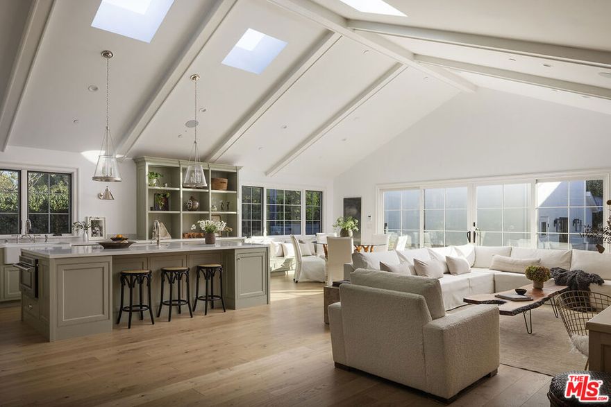 Tucked away on a quiet, tree-lined street North of Montana, 2515 Marguerita Avenue offers a refined blend of coastal ease and architectural elegance. This brand-new, single-level home includes a fully equipped guest house. Inside, the naturally lit interior contains an open living space and bar for easy gatherings. Beam ceilings, a chef's kitchen with Sub-Zero, Viking, and Miele appliances, and a serene indoor-outdoor flow make everyday living feel like a retreat. Each of the four ensuite bedrooms offers garden views and walk-in closets. A private, gated entry leads to a landscaped yard with a pool, terrace, and generous porchideal for warm Santa Monica evenings. Moments from the shops and cafs of North Montana Avenue and the Brentwood Country Mart, and just blocks from the beach and top-rated schools, this home balances privacy, comfort, and an effortless sense of place.