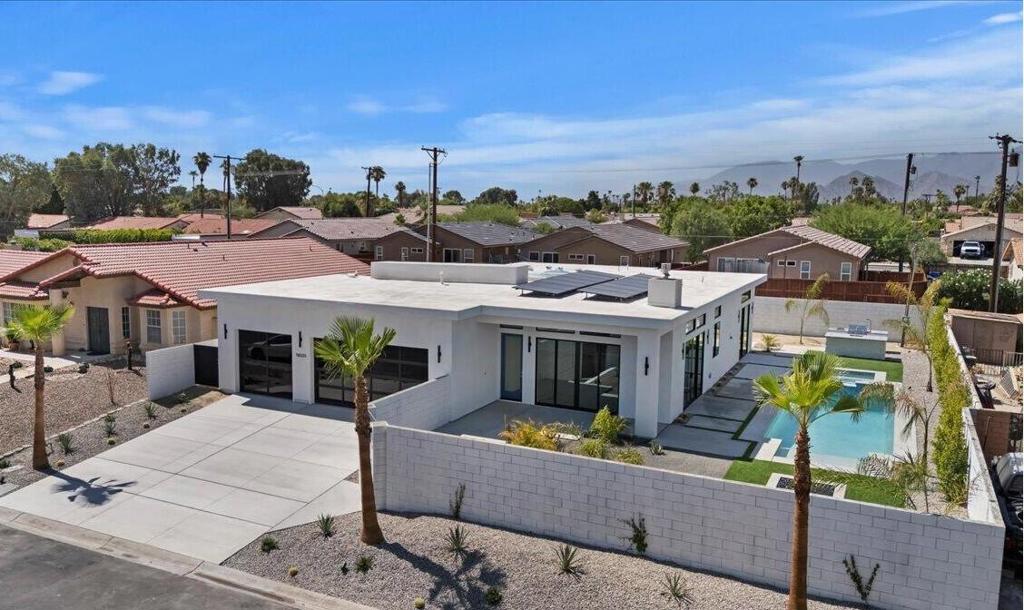Welcome to this brand new, expertly crafted home showcasing contemporary design and upscale finishes throughout and Short Term Rental Friendly! Boasting 4 spacious bedrooms and 3.5 designer bathrooms, this residence offers a chef-inspired kitchen with premium appliances, an oversized dining area perfect for gatherings, and a chic great room featuring a statement fireplace.Step outside to a beautifully landscaped backyard oasis ideal for entertaining--complete with a sparkling pool, spa, tanning ledge, built-in BBQ, covered patio, and a generous courtyard for relaxing or hosting under the stars. Situated on a large lot, this home blends indoor elegance with outdoor enjoyment like no other! Home also has PAID Solar!