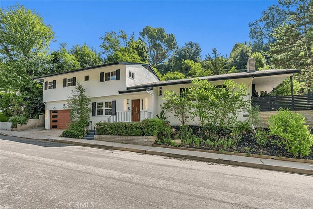 Tucked away on a peaceful cul-de-sac in Upper Bel Air, this fully remodeled 5-bedroom, 4-bathroom home offers 2,740 sqft of modern comfort and style. Located on lovely Hamner Drive, it’s close to top-rated Roscomare Road Elementary, quick freeway access, Beverly Hills, and Sherman Oaks. Inside, you’re welcomed by a bright den with custom built-ins—ideal for a home office or cozy family space. The main floor features a spacious living room, flowing into a formal dining area and a sleek kitchen equipped with Thor appliances. Fresh flooring, paint, and fixtures throughout add a clean, updated feel, plus there’s a stylish powder room near the stairs. Upstairs, find two guest bedrooms and a full bath, along with a large primary suite that includes a versatile adjoining room perfect for an office or nursery. A two-car garage completes the package. This move-in-ready gem is a rare find—don’t miss your chance to make it yours!