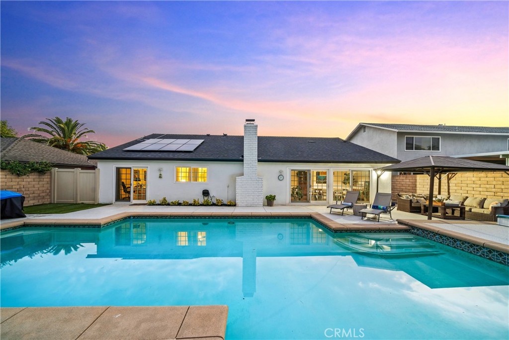 Presenting an unparalleled opportunity for single level pool yard living in highly sought after Mission Viejo. This stunning, turnkey residence is a freshly updated, single-level home, designed for effortless living. With 4 bedrooms, 2 bathrooms, and a meticulously finished 2-car garage with an epoxy floor, this property exemplifies ease of enjoyment and comfort. Step inside to find a grand entrance with a vaulted beadboard ceiling which sets a tone of elegance. The open-concept design seamlessly connects the living spaces, which are adorned with luxury vinyl flooring and filled with natural light from dual-pane windows. The renovated kitchen is a culinary enthusiast's dream. It showcases elegant quartz countertops, soft-close cabinetry with convenient pullouts, and high-end stainless-steel appliances. A sizable farmhouse sink, walk-in pantry, and breakfast bar provide both style and functionality, while an adjacent bonus living/dining area offers versatile space. The formal dining room opens directly to the backyard, creating a seamless flow for indoor-outdoor pool party gatherings. The home's serene living extends to a primary suite with elegant fixtures, a charming bay window reading nook with top-down/bottom-up blinds, and dual closets. The accompanying primary bathroom features a walk-in shower. Three additional bedrooms are equipped with ceiling fans and closet organizers, with two providing direct sliding door access to the beautifully landscaped backyard. A private oasis, the backyard features a stylish patio cover and a welcoming oversized swimming pool which will be perfect for countless days of fun in the sun with neighbors, family and friends. The spacious driveway offers ample parking for up to four additional vehicles. Beyond the property's boundaries, residents enjoy the exceptional benefits of the Mission Viejo lifestyle. Known for its safety, strong demographics, and outstanding quality of life, Mission Viejo provides access to award-winning schools and a wealth of recreational amenities, including over 40 parks, recreation centers, and access to freeways for convenient commuting. This unique property is also exempt from an HOA, offering enhanced freedom and financial savings. This is a rare opportunity to acquire a turnkey, single-level pool residence in one of Southern California's most coveted master-planned communities. We invite discerning buyers to experience the perfect blend of style, comfort, and convenience. Welcome Home!
