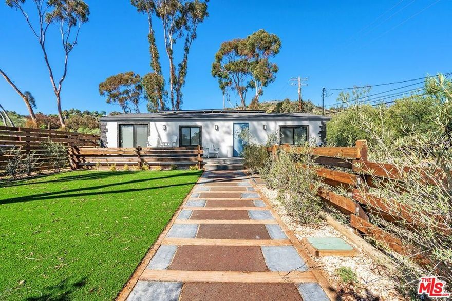 Recently renovated gated single-story ranch house w/ ocean view, large front yard w/ patio and mature landscaping. The living area features French white oak hardwood flooring, L-shaped sectional, gas fireplace, large TV and custom art, while the kitchen features an island w/bar seating, quartz countertops and brand-new stainless-steel appliances. The Primary Suite is well appointed w/ an ocean view, direct patio access and features a king-size bed, large TV and coastal art. Just down the hallway is a secondary bedroom that also comes w/ an ocean view, queen-size bed and full size stand alone mirror. Lastly - there is a second full bathroom, laundry room w/ brand-new washer/dryer and rear access to an additional large patio. This property is a multi-acre ranch that rests adjacent to miles of highly desirable hiking and riding trails, which the Tenant has the opportunity to participate in the Equestrian lifestyle if he or she desires. Located right across from world class dining, such as Geoffrey's and one of the sandiest beaches in Malibu - Escondido Beach.