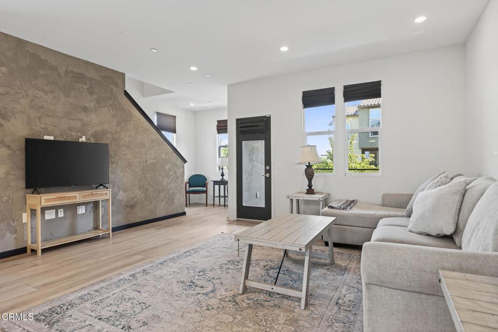 Stunning Park west Townhome built in 2020. Beatifully upgraded on a desirable corner lot with mountain views.This home features a bedroom and full bath on the first floor.Second floor offers an  upgraded island kitchen with quartz countertop ,white shaker cabinets,Stainless steel appliances.Walk into open and spacious living room  high ceiling with media niche, recessed lighting, and luxury vinyl plank flooring.Spacious primary bedroom with walk-in closet.All bathrooms have upgraded tile flooring and quartz countertops.This integrated smart home is equipped with a ring doorbell, nest thermostat, automatic faucets  and moreDedicated laundry room, tank-less water heater and two car garage.Conveniently located steps away from community amenities including BBQ areas, pool and children's play ground and patio with fire place.Highly desirable location next to park, school, bike trail and shopping center.