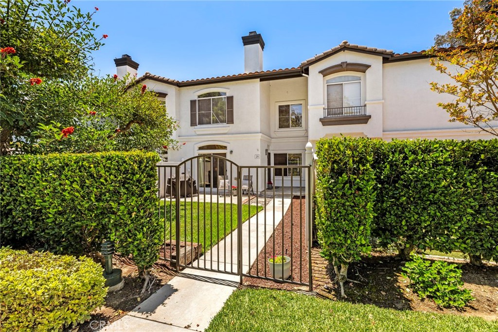 WELL- THIS is the one you have been waiting for! Completely DARLING! One of the really fabulous features here, is a real honest to goodness YARD!!!! You walk into the large beautiful front yard through a gate where you have a beautiful lawn, gorgeous tree, patio space for a BBQ and entertaining and spacious private home entrance! Forget about all the homes you've seen...where you tell yourself that a tiny patio or a deck up off a living room is enough for your lifestyle! INSIDE, you have a great room with a fireplace, slider to the yard, a spacious kitchen open to the living area with even enough room for a small table, granite counters & lots of storage! There's a giant walk in closet for storage galore or a fun 'Play Room' for little people! There's a 1/2 bath, dining room and direct access to the 2 car garage and laundry area. As you head upstairs you'll notice BEAUTIFUL wood flooring throughout the entire upper level. There's a remodeled hall bathroom for the secondary bedroom with beautiful tile, linen storage and the guest room or second bedroom. Closet area is ready to customize and a lovely view out the window. Then the master suite - which features a highly customized bathroom with an amazing wall of clothing storage, a separate 'water closet', and a large shower! Again - its cheerful and sunny with a nice view, ceiling fan, and some excellent closet space. There is all new fresh bright paint, new PEX piping, and a complex that for once..... has plenty of guest parking, beautiful and convenient surroundings, close to great schools, shopping and all of the utterly amazing SAMLARC amenities! Absolutely EVERYTHING you could ever want as far as fun! Tennis, pickleball, basketball, parks, playgrounds, BBQ areas, fitness opportunities, Beach Club and lagoon, multiple pools/spas and so much more. This is an absolute treasure - don't let it slip through your fingers!
