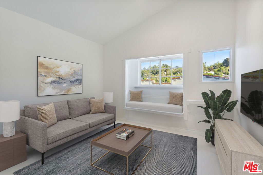 New Co-Ownership Opportunity: Discover this one-of-a-kind, charming property within a 3-unit Tenants in Common lot, offering a treehouse-like atmosphere with both privacy and natural beauty in the sought-after Elysian Heights/Echo Park Hills neighborhood. Featuring spacious, versatile rooms with hardwood floors throughout, tiled bathrooms, and in-unit washer/dryer hookups, this home is designed for comfort and convenience. The expansive yard provides plenty of outdoor space for relaxation or entertainment. With two separate entry points, the property allows for flexible, private access, enhancing its unique appeal. Nestled near Dodger Stadium, this charming residence boasts a serene atmosphere, views, and beautiful landscaping featuring lemon, persimmon, and guava trees that enhance your outdoor space. A true hidden gem, this home seamlessly blends modern amenities with distinctive architectural character.