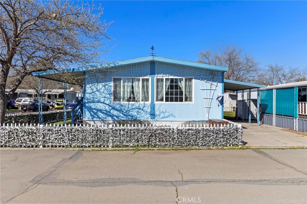 Discover the perfect blend of comfort, convenience, and charm in this beautifully maintained 2-bedroom, 2-bathroom manufactured home. Spanning 1,440 sq. ft. and built in 1980, this spacious home offers a thoughtful layout designed for both relaxation and entertainment. As you step inside, you'll immediately appreciate the inviting atmosphere and natural light that flows through the dual-pane windows, enhancing energy efficiency and creating a bright and airy feel. The well-appointed kitchen features a dishwasher, making meal prep and cleanup effortless, while the dedicated dining room provides the perfect setting for enjoying meals with family and friends. The spacious primary suite serves as a private retreat, offering comfort and tranquility with plenty of room to unwind. The additional bedroom is equally inviting, perfect for family, guests, or even a home office. A whole house fan keeps the home comfortable year-round, promoting air circulation and energy savings. Whether you’re gathering in the family room, hosting game nights in the game room, or simply enjoying a quiet evening at home, this property is designed to accommodate a variety of lifestyles. Practicality meets convenience with an in-home laundry area, ensuring that everyday chores are a breeze. Step outside to find a storage shed that provides extra space for tools, outdoor equipment, or seasonal items, helping keep your home organized and clutter-free. The carport offers covered parking, protecting your vehicle from the elements and adding extra convenience to your daily routine. This home is ideally situated close to a variety of outdoor activities, making it a paradise for nature lovers and adventure seekers. Enjoy easy access to scenic bike trails, peaceful lakes, and picturesque rivers, perfect for hiking, biking, fishing, or simply taking in the beauty of the great outdoors. Shopping and dining options are also just moments away, allowing you to enjoy the best of both worlds—peaceful surroundings with the convenience of nearby amenities. With its spacious layout, modern conveniences, and unbeatable location, this home is a true gem waiting for you to make it your own. Don't miss out on this incredible opportunity to experience comfort, functionality, and a fantastic lifestyle all in one place! Schedule your showing today!