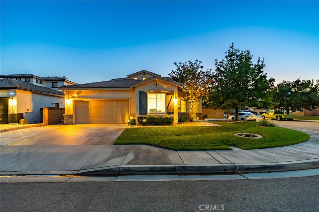 ***LIVE BEAUTIFULLY*** Move-In Ready 4-Bedroom Home in West Lancaster! This home offers nearly 2,600 sq. ft. of living space, is built in 2007, and is perfectly situated on a desirable corner lot. With gorgeous curb appeal, an extended driveway, and a third parking spot reinforced for heavy trucks, this home blends practicality with style. Step inside to a bright, open floor plan featuring tile flooring throughout all common areas and recessed lighting that adds a modern touch. The spacious kitchen is complete with stainless steel appliances, quartz counters, a pantry, and a large center island that flows seamlessly into the inviting family room—highlighted by a cozy fireplace. The downstairs primary suite offers backyard access and a luxurious, recently remodeled (2025) bathroom with dual vanities, a relaxing soaking tub, a stone-tiled walk-in shower, and a generous walk-in closet. An additional bedroom is also downstairs. Upstairs, you’ll find two additional bedrooms that offers a Jack-and-Jill bathroom—perfect for family or guests. All bathrooms have granite counters. Enjoy year-round comfort with a new furnace installed in February 2025. Outside, your private backyard features a covered patio and a spacious grassy area—ideal for relaxing or entertaining. This home truly has it all—style, space, and thoughtful upgrades—making it an exceptional find in West Lancaster.