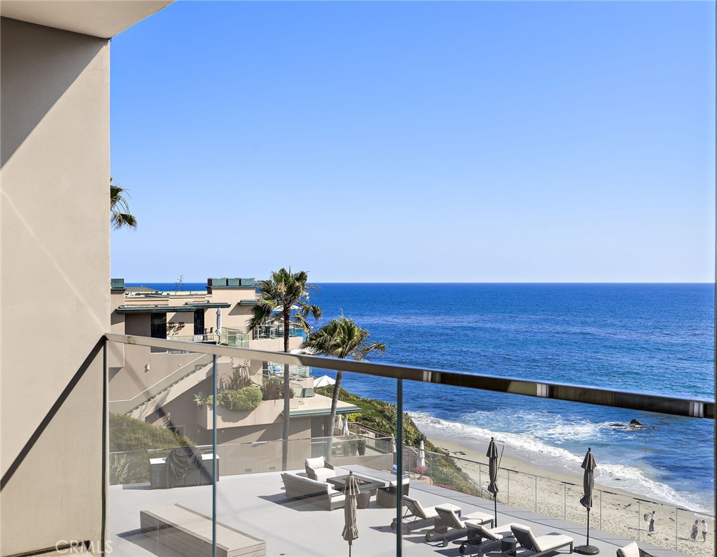 Experience resort-style coastal living with this rarely-available, top corner end unit condominium. Situated in the ocean front Laguna Sands complex, which has recently completed a multi-million renovation providing truly upscale ocean front living. This exceptional residence offers spectacular ocean and whitewater views from a private ocean-view deck where you will experience the sights and soothing sounds of the shore below. Open-concept layout seamlessly connects the living, dining, and kitchen areas. Granite kitchen open to the views with bar, stainless steel appliances and custom cabinetry. A spacious layout overall with 3 bedrooms and 2 baths. The sizeable master suite enjoys an ocean view, multiple closet systems including a walk-in and a dual vanity bathroom with stone shower. Secondary bedrooms have closet storage, a hallway bathroom with artistic ceramic bowl vanities and stone shower. In unit laundry with newer stackable washer/dryer. This private, highly secure gated building affords not only direct access to the beach but also an ocean front pool with new decking. Two large community deck terrace areas have tremendous ocean front views and have been completely renovated, including lounge furnishings, barbecues and fire pits. Ease of living with elevator access to all levels. 2 car parking in the gated subterranean garage, large dedicated storage closet, storage cabinets and bike/kayak community storage. HOA dues include most utilities excepting electricity, cable/internet. Prime location next door to the iconic, renovated Surf and Sand Resort. In the heart of the HIP district just yards to the best restaurants, shops and services. Excellent accessibility to areas of town with a trolley stop right outside the building and just minutes to downtown, your Laguna lifestyle awaits here on the ocean front.