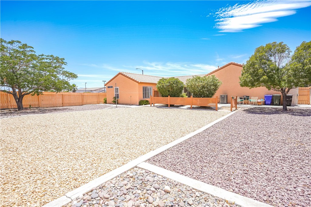 Step into comfort and style with this delightful 3-bedroom, 2-bathroom corner-lot gem! You’ll love the bright interior featuring timeless shutters throughout and newer flooring that adds a fresh, modern touch. The enclosed porch and covered patio provide perfect spaces to enjoy your morning coffee or relax in the evenings. Sitting on an approx. 11,086 sq ft lot, the landscaped backyard is ideal for BBQs, play, or future possibilities. Stay cool with an AC unit that’s less than a year old. Conveniently located across from Discovery School of the Arts and just minutes from freeways, shopping, and dining. Pride of ownership is evident—this home has only had two owners since it was built.