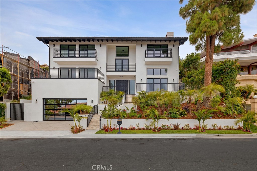 RARE LEASE OPPORTUNITY: Brand New Ocean-View Estate in Palos Verdes Estates! Be the first to live in this just-completed, fully rebuilt coastal estate in Upper Lunada Bay, offering unobstructed ocean views and a luxurious, turn-key lifestyle. Taken down to the studs and meticulously reimagined with high-end finishes throughout, this 5-bedroom, 4-bathroom home also includes a dedicated office or flex space and showcases brand new everything—from a chef’s kitchen and spa-inspired bathrooms to top-tier appliances, a smart home system, fiber optic wiring, HVAC, exterior security cameras, and premium fixtures. Thoughtfully designed for modern living and effortless entertaining, the home features a dramatic double-height formal living room, expansive open-concept dining and entertaining space with a wet bar, breakfast nook, and ocean-view terrace, plus a spacious wine cellar and steam sauna. The primary suite and additional ocean-view bedrooms offer a serene retreat, while a junior suite opens directly to the backyard. Additional highlights include an attached garage with EV charging and lush landscaping including a beautifully ocean view designed walking/hiking path. Located minutes from shops, dining, and everyday conveniences, and within walking distance of top-rated Palos Verdes High School and Palos Verdes Intermediate School. Palos Verdes Estates Residents may enjoy exclusive access to the private beach club, golf club, and tennis club, exclusive benefits of this prestigious coastal enclave. **Water and landscaping are included.**