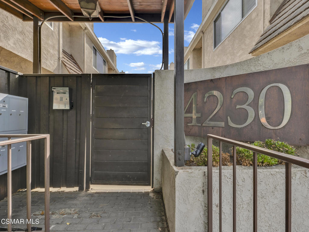 Spectacularly quaint, quiet and charming complexes are rarely found. Step through the gates into the unique and lovely common courtyard. Recently updated and modernized throughout. A cozy fireplace welcomes you to the bright, spacious living room with wood type laminate flooring leading into a sizable, private patio perfect for relaxation, BBQs and entertaining. Remodeled downstairs powder bath with new fixtures, commode, sink. Kitchen features a new range, stone type counters, fixtures, sink, updated and much more. Built in microwave and updated cabinets sparkle. Kitchen breakfast nook area and plenty of storage. Includes refrigerator. In-unit laundry includes washer and dryer. Two upstairs primary suites, one with a stately wood beamed ceiling and fan, both ensuite baths are updated with new fixtures, shower glass, stone type counters and much more. Both bedrooms have ample storage and spacious closets. This is the home you have been searching for! Warm, welcoming and awaiting its new owner!