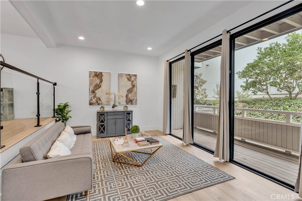 Experience the pinnacle of coastal elegance in this exquisitely renovated 3-bedroom, 3-bathroom condo nestled within the coveted Newport Crest community. Every inch of this stunning residence has been thoughtfully updated, showcasing brand-new laminate flooring, fresh paint, chic modern lighting, and sophisticated cabinetry with sleek countertops throughout. Step into the open-concept living space, where sunlight dances across the inviting interiors, seamlessly connecting the stylish kitchen, dining area, and spacious living room. The primary suite is your private retreat, boasting a luxurious walk-in closet and an exclusive balcony – the perfect spot to sip your morning coffee or unwind under the stars. Additional balconies provide versatile outdoor spaces, ideal for entertaining or soaking in the coastal breeze. Situated just moments from the pristine shores of Newport Beach, vibrant shopping, gourmet dining, and top-tier schools, this home is the epitome of style, comfort, and convenience. Whether you're hosting a lively gathering or savoring quiet moments, this Newport Beach gem promises a lifestyle of unparalleled beauty and sophistication.