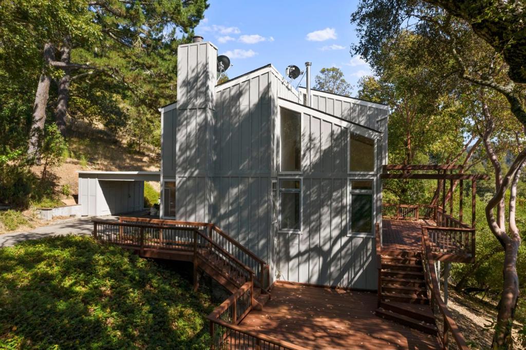 Ultimate privacy and incredible views from virtually every room, nearly 2.5 acre retreat-like sanctuary in the Los Gatos - Santa Cruz mountains. Great wildlife viewing and awesome sunsets. This fully remodeled home is perched at the top of a private road. Perfect for those seeking peace and serenity in a natural setting. The house has exotic hardwood floors, 3 bedrooms, 2 1/2 renovated bathrooms, designer kitchen, Marvin windows, french doors and soaring ceilings. Updates include all new interior and exterior paint, granite islands, Viking, Miele, Sub Zero, and Toto appliances and fixtures. Sprawling entertainment decks wrap this home. The fully finished basement has plenty of space for extra guests, and office space. Only 15 minutes to the beach and 15 minutes to downtown Los Gatos. Conveniently located next to beautiful Scotts Valley with award winning schools.