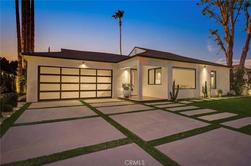 Welcome to 8161 Encino Ave, a stunning contemporary haven in Northridge, California. This 4-bedroom, 3-bathroom masterpiece has undergone a complete remodel, embodying modern design and sustainable living.

As you enter through the secure and gated entrance, you'll notice the low-maintenance ficus trees enveloping the property for ultimate privacy. The exterior showcases a Santa Barbara finish, complemented by larger windows that flood the interior with natural light.

For the environmentally conscious, this home is equipped with solar panels and a Tesla charger. The landscaping has been thoughtfully designed with turf replacing traditional grass, minimizing maintenance. Exterior gate and lighting are seamlessly controlled via wifi, with lights automatically illuminating the surroundings at sunset and gracefully dimming at sunrise.

Security and convenience take center stage with smart home features, including Ring security cameras, main door smart locks, and climate control accessible through a user-friendly phone application. The garage, complete with a new door, offers a work station, ample shelving, and storage. The entire home and garage have been insulated, ensuring comfort in all weather conditions.

Step into the backyard oasis where a heated pool and jacuzzi await. The pool area, featuring a natural gas firepit, is controllable through the smart home application. An entertainer's dream, the backyard boasts an expansive deck with a retractable sunbrella, while one of the bathrooms provides direct access for guests or a quick post-pool dry off.

Inside, the home exudes luxury with recessed lighting and art gallery-style lights. The kitchen has been tastefully remodeled, showcasing an island for dining and socializing. White oak accents seamlessly connect the spaces, while modern roller windows offer privacy and blackout options.

Experience a touch of Colombian charm with imported rustic lamps that create a warm and inviting ambiance in the backyard. The sliding stacking doors leading to the outdoor space enhance the seamless indoor-outdoor living experience.

Whether you seek a space for entertaining or unwinding, 8161 Encino Ave sets the stage for a lifestyle where luxury, technology, and comfort converge in perfect harmony. Welcome to your contemporary retreat in the heart of Northridge.