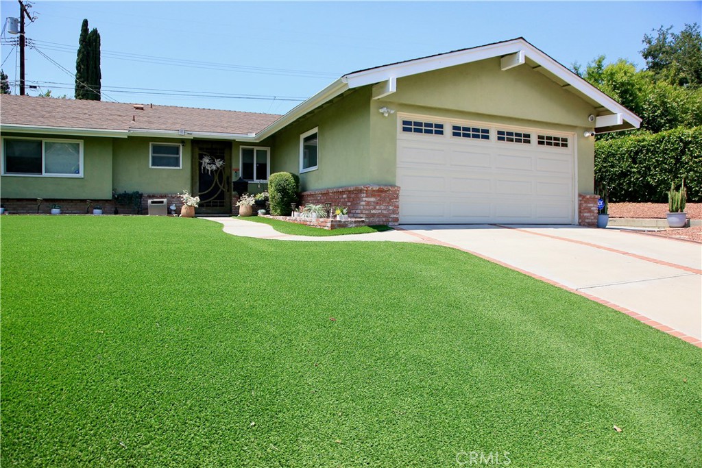 Welcome to this beautifully maintained 3-bedroom, 2-bath Sylmar home on a spacious 7,436 sq ft lot! This charming single-story residence offers many new improvements modern living space and showcases thoughtful upgrades including new energy-efficient windows, central air conditioning, and drought-resistant landscaping for low-maintenance curb appeal. The light-filled living room features a cozy fireplace and smooth ceilings, while the adjacent dining area and tiled kitchen provide a functional layout for everyday living.
The primary suite includes a stylish ¾ bath with full-height tile, while the hall bathroom features a classic over-the-tub shower with floor-to-ceiling tile work. Step through French doors into a bonus "man cave" retreat (approx. 170 sq ft, unpermitted) perfect for a home office, gym, or media room. Outside, enjoy a manicured front yard with artificial turf and a private backyard oasis with gravel hardscape saving on water bill. Upgraded vinyl fencing giving you backyard privacy. Additional highlights include a finished 2-car garage with drywall and smooth ceiling, an automatic garage door, and wrought-iron front security door. Conveniently located near parks, schools, and freeway access—this move-in ready home offers a rare combination of charm, comfort, and value.