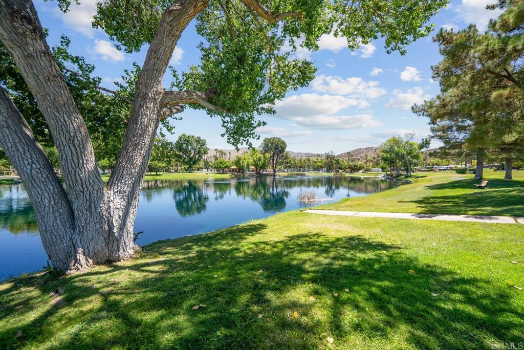 Welcome to Your Private Oasis at Rancho California RV Resort! Discover unmatched privacy and resort-style living with this exceptional large covered lot in the heart of Southern California. Perfectly designed for both relaxation and entertaining, this property boasts an outdoor kitchen complete with a spacious built-in BBQ grill, island with refrigerator, ice maker, cooler, and sink. The backyard is entertainment-ready and framed by stunning mountain views and beautiful curb appeal. Enjoy full access to the resort’s incredible amenities, including a 14-hole executive par-3 golf course, five pools and jacuzzis, six lighted tennis and pickleball courts, a dog park, clubhouse, fitness center, hiking trails, horseshoe lawn, scenic lakes, and an onsite grocery market and restaurant. With 24/7 gated security and no age restrictions, Rancho California RV Resort offers both peace of mind and a vibrant community atmosphere. Whether you’re looking for a personal retreat or a rental income opportunity, this rare corner lot delivers the best of luxury and leisure living in a top-tier resort.