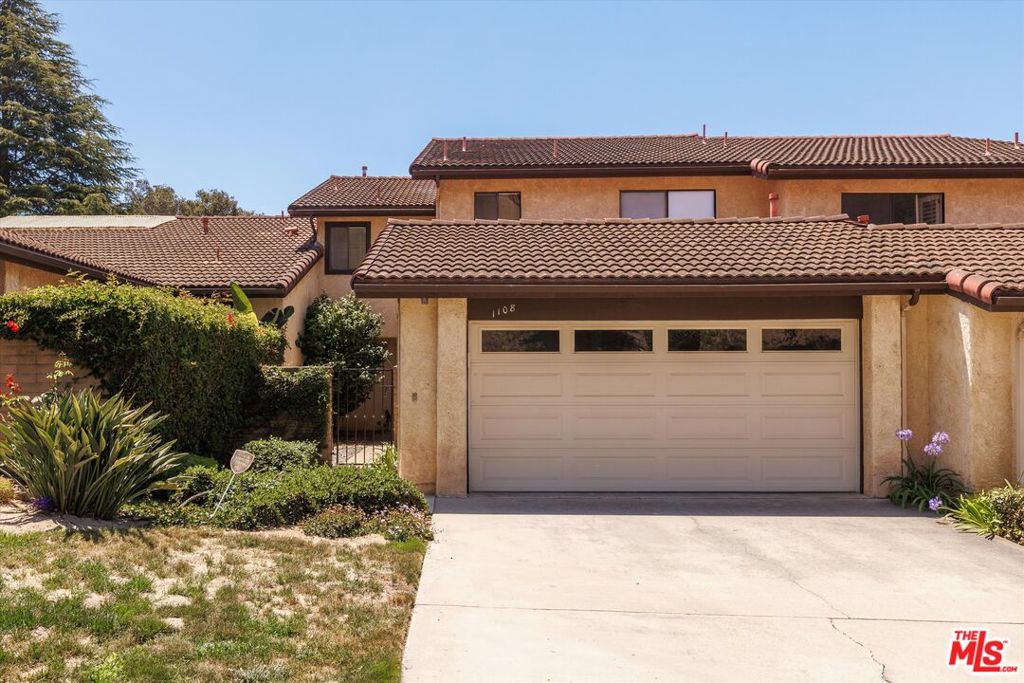 Gated community, two-story townhome for sale in Orcutt's Creekridge Villas nestled near the Clark & Bradley shopping hub with grocery, banking, pharmacies, and coffee shops within walking distance. This spacious, newly-carpeted home built in 1977 has 2 bedrooms, 2.5 baths, and 1805 SF of interior space; it is updated, yet it has enough vintage features to retain its charm. The kitchen has been modernized with newer flooring, painted cabinetry, a glass tile backsplash, butcher block counters, and stainless steel appliances, including your own mini wine fridge. The living room / dining room has a spectacular second story vaulted ceiling, a brick facade fireplace, a floating staircase, and an original retro chain light fixture. Upstairs there are two primary suites offering occupants their own personal space. The larger primary suite has two closets, and an ensuite with dual sink vanity, a Roman tub, and a step in shower. The property includes a gated front courtyard, a two car garage with laundry facilities, a view-fenced arbored back patio overlooking a lovely green belt. This sought after community offers a picturesque setting, a clubhouse, a pool and a spa for resident use; $653 monthly association dues and only a short trip to Old Town Orcutt's newly minted wine tasting and restaurant scene. *Information deemed reliable but not guaranteed or verified by the broker.