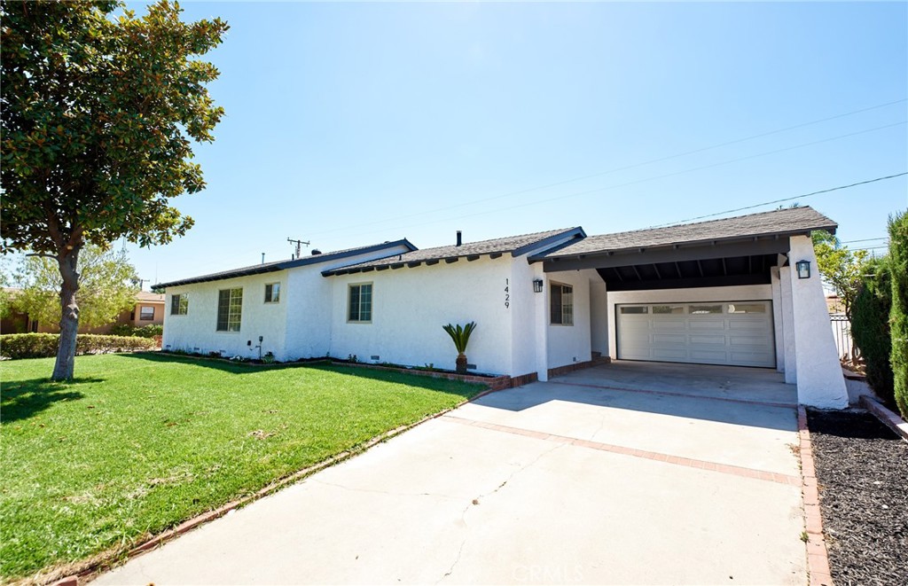 Remodeled single story Covina pool home. Double door entry. New kitchen cabinets, quartz countertops, and tile backsplash. Luxury vinyl plank flooring throughout. Tiled fireplace in living room. Lighting and ceiling fans. Indoor laundry. Central air and heat. Primary bedroom has full bath with tile. Two car garage with epoxy floor. Carport with high ceiling pitch. Private backyard with pool to finish summer in style. Appliances include stove, dishwasher, and microwave. Landscaped front yard. Close to shopping, restaurants, and 210 fwy