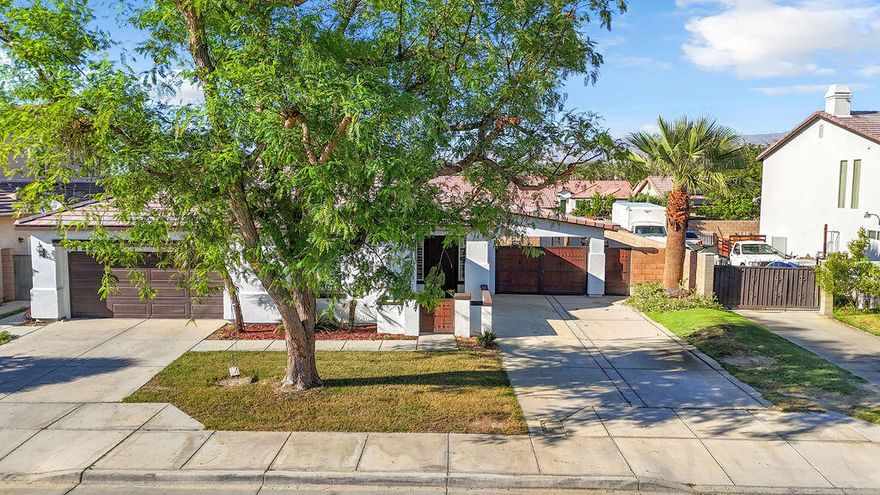 This charming 3 bedroom, 2 bath home is the lowest-priced home of its size in all of Coachella, offering incredible value and comfort. It welcomes you with a cute front courtyard that sets the tone for the inviting open layout inside, complete with stainless steel appliances in the kitchen. The spacious primary bedroom features a large closet, while the huge covered patio in the backyard is perfect for entertaining. An additional driveway provides ideal space for RV parking or work trucks, making this property as practical as it is stylish. With no HOA, this home is a rare find you won't want to miss!