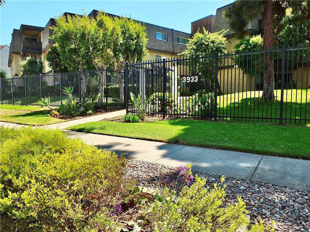 Welcome home to this top floor Virginia Village condo. This freshly painted home features two bedrooms and two bathrooms, offering a comfortable and stylish living experience. The spacious living room opens up to an attached deck with a view of the community pool. The separate kitchen and dining area is equipped with stainless steel appliances and plenty of cabinet space, ideal for those who love to cook. The primary suite has two large closets and a private bathroom with convenient laundry hookups. Additionally, there is a guest bedroom and bathroom just down the hall. This home also features two dedicated parking spots and a private storage room in the community garage, ensuring ample space for belongings. Living here means enjoying the benefits of a prime location, with close proximity to the city's finest shopping, dining, and entertainment that Bixby Knolls offers. Plus the excellent schools, parks, and public transit that are all easily accessible.