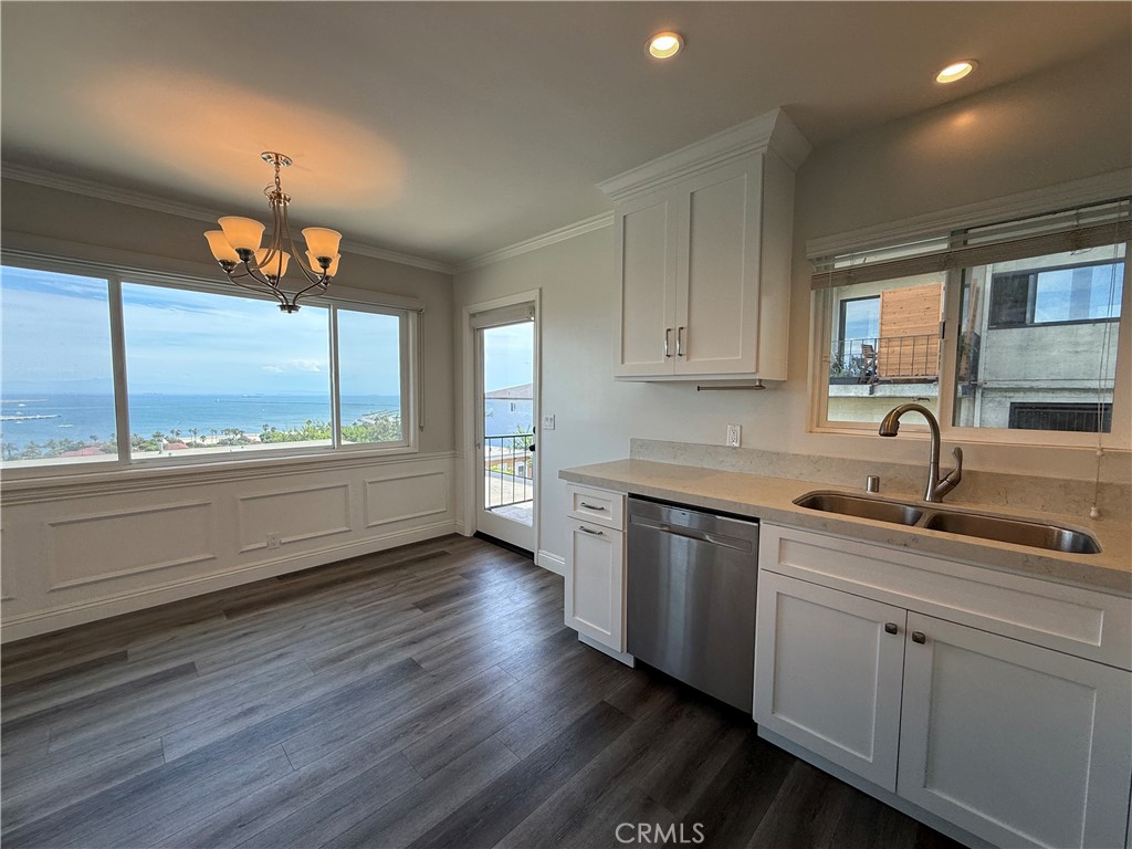 This penthouse unit is located in quaint Pt. Fermin area of San Pedro and has been remodeled with newer kitchen & bathroom cabinets, quartz countertops, dishwasher, microwave, recessed lighting, flooring, dual glazed windows and window coverings, ceiling fans. This unit features a panoramic view from Dana Point to Downtown Los Angeles. Stackable washer and dryer included.