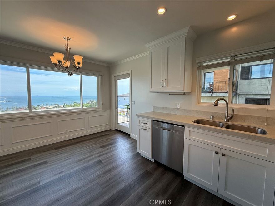This penthouse unit is located in quaint Pt. Fermin area of San Pedro and has been remodeled with newer kitchen & bathroom cabinets, quartz countertops, dishwasher, microwave, recessed lighting, flooring, dual glazed windows and window coverings, ceiling fans. This unit features a panoramic view from Dana Point to Downtown Los Angeles. Stackable washer and dryer included.