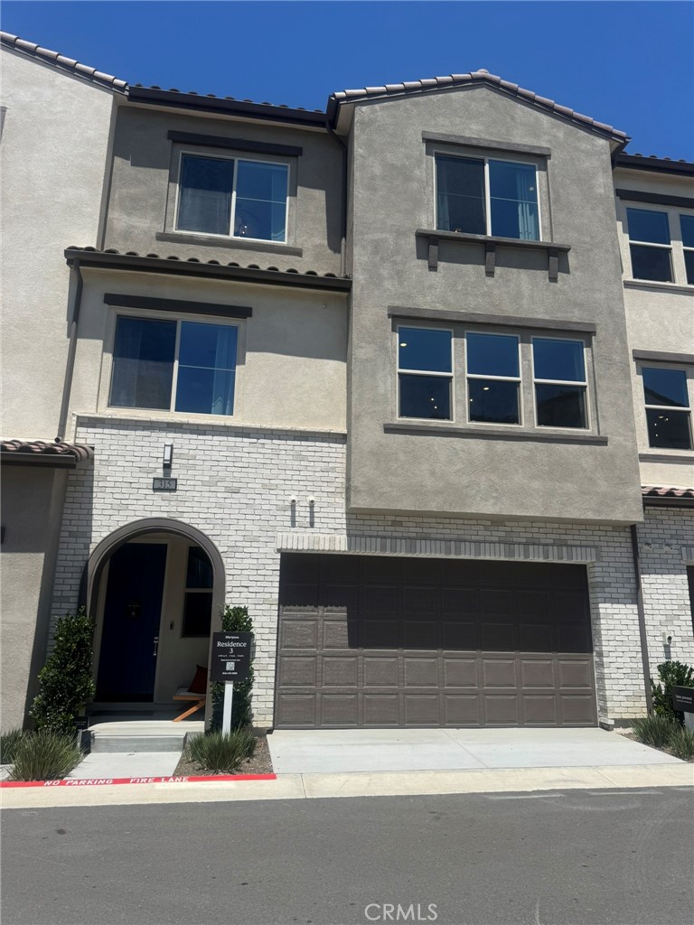 New, Never been lived in home in the prestigious Mariposa at Rienda community of Rancho Mission Viejo, this exquisite three-level townhome, previously the builder’s model, showcases unparalleled luxury with high-end upgrades throughout. The second level features a spacious open-concept Great Room seamlessly connected to a gourmet kitchen, equipped with Samsung stainless steel appliances, including a 36" side-by-side refrigerator with Touch Screen Family Hub™, a Wi-Fi-enabled gas range, microwave, and smart dishwasher, complemented by quartz countertops, custom tile backsplash, under-cabinet lighting, and a roll-out shelf for hidden recycling and trash bins. A secondary bedroom and full bathroom with a shower-tub combo, ceramic tile accents, and Piedrafina™ countertops provide an ideal space for guests or a home office. The third level boasts a luxurious owner’s suite with a walk-in closet featuring wood shelving, a shoe rack, and a dual-sided mirrored salon door, paired with an en-suite bathroom showcasing a framed shower with full-height ceramic tile, Piedrafina™ countertops with a 6" backsplash, shaker-style cabinetry with soft-close hinges, and an elongated comfort-height toilet. Another well-appointed bathroom on this level includes a fiberglass-surround shower-tub combo and Moen® hardware. Energy-efficient solar panels ensure low utility bills, while smart home features like a Ring Video Doorbell Pro, smart thermostat, and Wi-Fi deadbolt enhance convenience. The two-bay garage includes insulated doors, an automatic opener, and a 240v electric vehicle charger. Additional highlights include an 8' entry door, elegant paneled interior doors, LED lighting, dual-pane windows, and a full-size stackable washer and dryer. Nestled within 23,000 acres of scenic open space, residents enjoy resort-style amenities, including clubhouses, pools, fitness centers, hiking trails, parks, and retail spaces, with South Orange County’s premier shopping, coastal beaches, and botanical gardens just minutes away. Contact us today to lease this move-in-ready masterpiece!