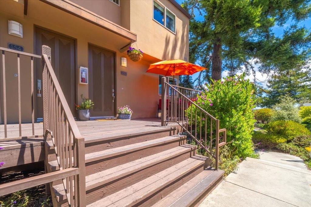 Beautifully updated 2-bedroom, 1.5-bath end-unit condo featuring panoramic ocean views of Monterey Bay and the surrounding forest. This light-filled home boasts vaulted tongue-and-groove wood ceilings and hardwood floors throughout. The gourmet kitchen includes a gas range and ample cabinet space along with granite counters. Enjoy indoor-outdoor living with a private balcony and patio both offering stunning views. This unit captures an abundance of natural light through extra windows exclusive to this unit. A semi private front porch adds an additional touch of serenity. This home Includes two parking spaces in the underground garage and a storage space. Prime location close to beaches, trails, dining, and shopping. A perfect coastal retreat or full-time residence.