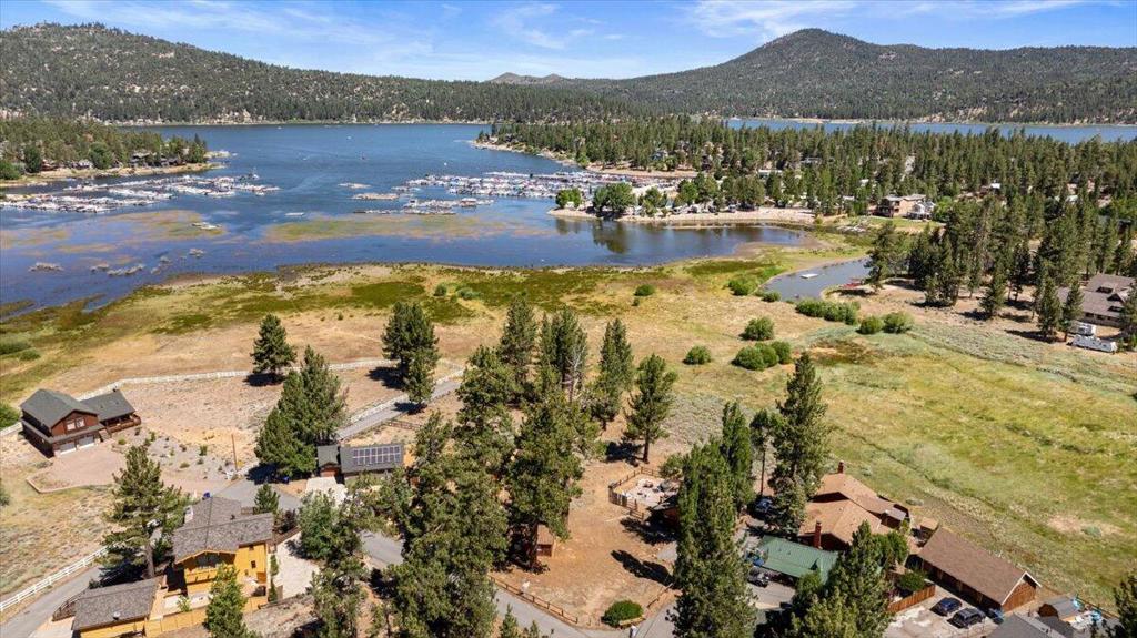This is a waterfront property sitting on over 55,000 SQFT of land. Existing home is a two bedroom 1bath home built in 1950. The home needs some TLC however we believe the value is truly on the upside. Whether you envision a lakeside retreat, a vacation home/ rental or a custom rebuild, this is a great property with endless possibilities. Waterfront parcels of this size and location are hard to find. Don't miss your chance to own this unique waterfront view home. With vision and care this could become a remarkable escape. Lot next door at 655 Lintner is included in the asking price. This lot is41,000 SQFT. Bayview lot size is 15000 SQFT for a total of 55,000 SQFT.