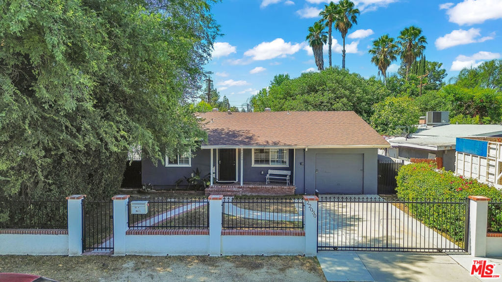 TRADITIONAL HOME ON EXPANSIVE LOT IN CANOGA PARK. This remodeled home includes three bedrooms, two bathrooms and an attached garage that has been converted into a fourth bedroom. The property features an open concept kitchen opening to a dining room and living room with double pane windows. The kitchen offers custom white cabinetry, a stainless dropdown hood, quartz counters, and stainless-steel appliances. The primary suite has a large closet with en-suite remodeled bath with custom tile shower enclosure, glass doors, tile floors, and granite counter. Two generous guest bedrooms share a remodeled guest bath and there is a fourth convertible garage/bedroom. The private, large yard provides amazing options for additional living space, possible ADU, pool and other utdoor amenities. The ideal location central to Westfield Topanga, The Village, Fallbrook Center, Orange Line Metro, & freeway creates an excellent opportunity for owner/users, investors or developers.